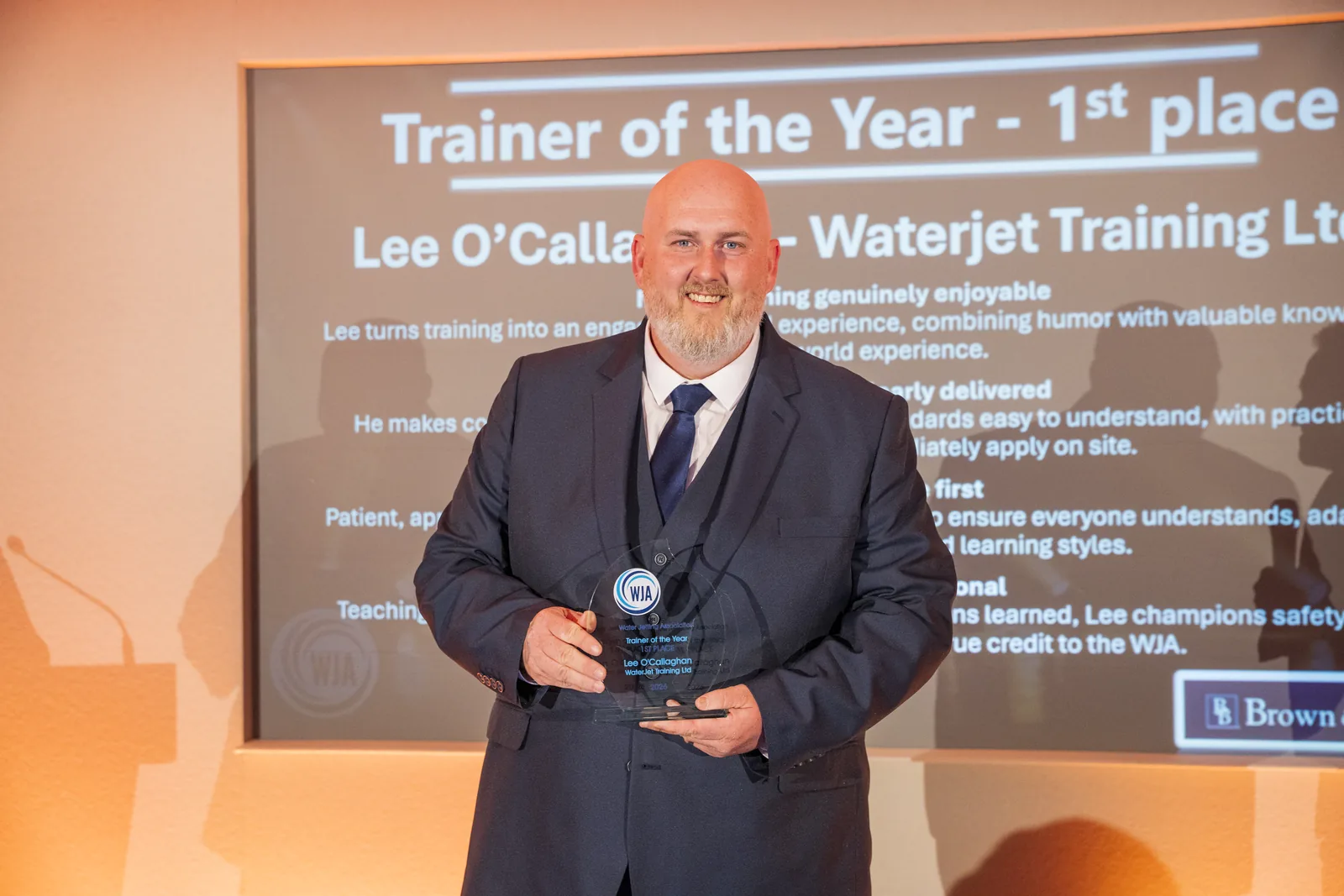 Lee O’Callaghan of WaterJet Training Ltd receiving Trainer of the Year