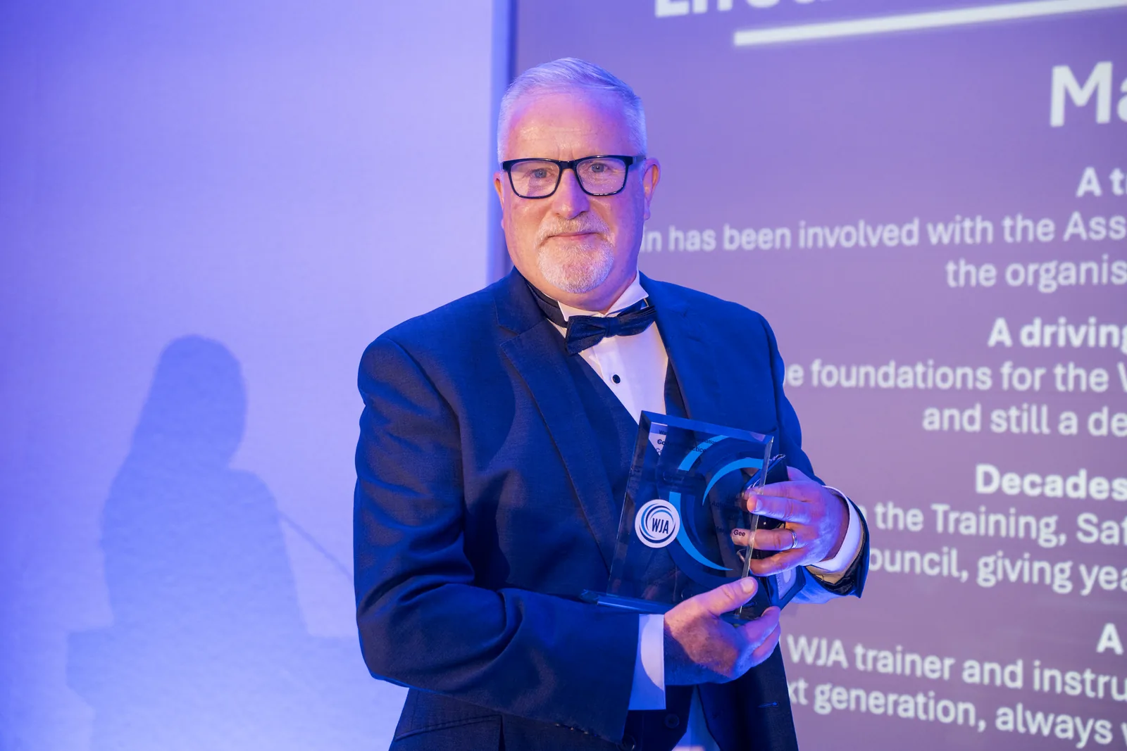 Darren Hamilton collecting the Lifetime Achievement award on behalf of Martin Gee