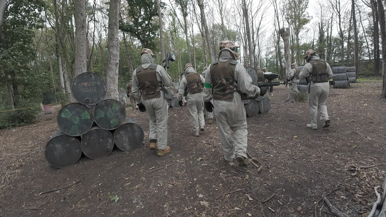 WJA members moving between paintball obstacles