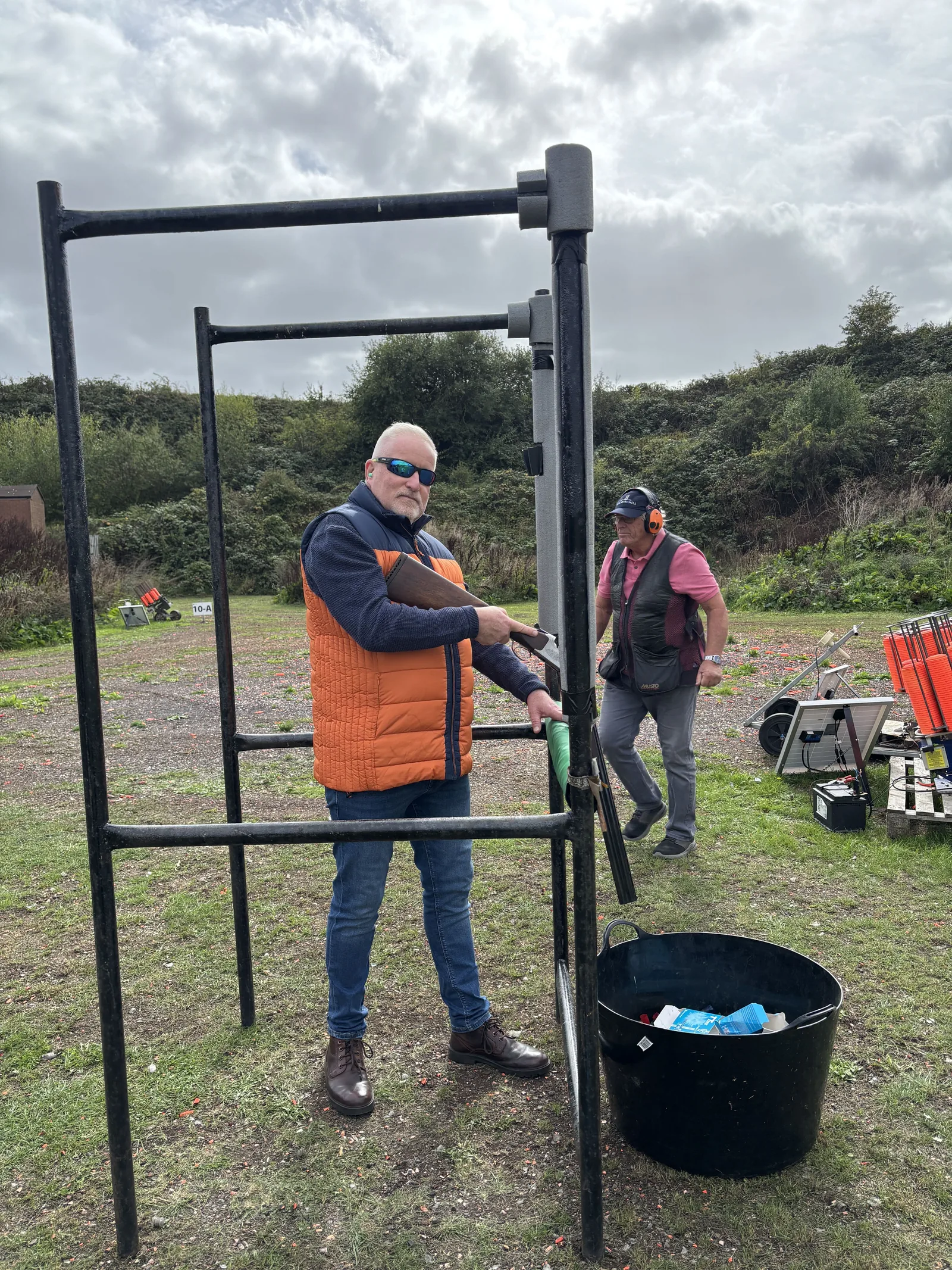 A participant preparing at the clay shooting stand